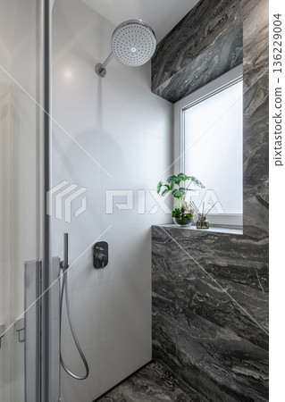 Modern Shower Interior with Dark Marble Tiles and Window Modern Shower Interior with Dark Marble Tiles and Window 136229004