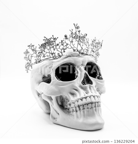 Human Skull with Silver Crown on White Background 136229204