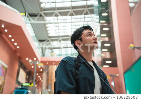 A man looking up at the airport. Photo courtesy of Kansai International Airport (KIX). A man looking up at the airport. Photo courtesy of Kansai International Airport (KIX). 136229508
