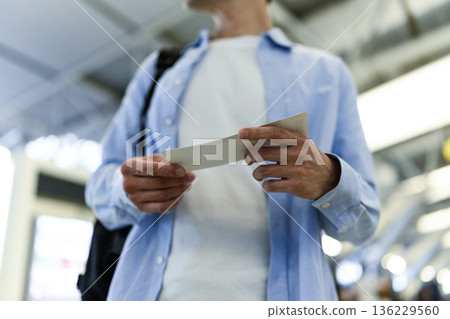 A man checking his boarding pass. Photo courtesy of Kansai International Airport (KIX) A man checking his boarding pass. Photo courtesy of Kansai International Airport (KIX) 136229560