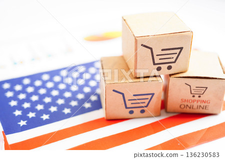 Online shopping, Shopping cart box on US America flag, import export, finance commerce. Online shopping, Shopping cart box on US America flag, import export, finance commerce. 136230583