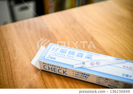 Pregnancy test on a wooden table Pregnancy test on a wooden table 136230849