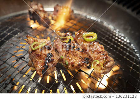 Juicy beef ribs grilled over a flame on a grill Juicy beef ribs grilled over a flame on a grill 136231128