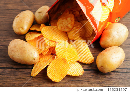 Potato chips , delicious BBQ seasoning spicy for crips, thin slice deep fried snack fast food. 136231297