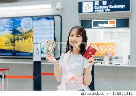 A woman exchanging money at the airport (Photo courtesy of Kansai International Airport (KIX)) A woman exchanging money at the airport (Photo courtesy of Kansai International Airport (KIX)) 136231312