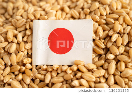 Japan flag on grain wheat, trade export and economy concept. Japan flag on grain wheat, trade export and economy concept. 136231355