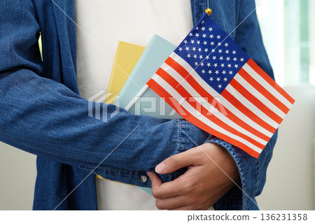 Learn English language, Asian teenage student hold book with flag in course at school. 136231358