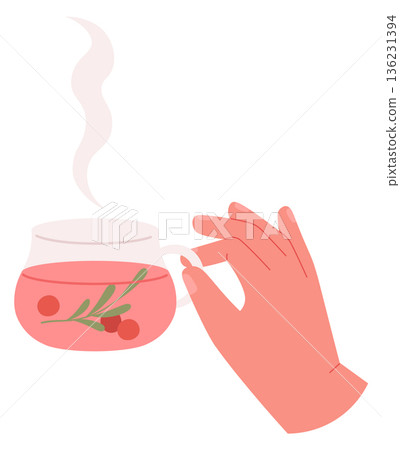 Hand hold hot herbal tea with winter berries 136231394