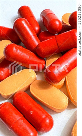 Detailed View Of Supplement Capsules And Tablets With Label Information. Studio Shot Showcasing Vibrant Capsules And Pills With Clear Labeling For Health Marketing 136232086