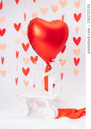 Red heart-shaped balloon on white background with decorative hearts. Valentines Day symbol, love, romance, minimal festive concept 136232310