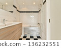 A sleek and contemporary bathroom featuring white tiled walls, a wooden vanity, and stylish black and white flooring. Perfect for design inspiration and home decor ideas. 136232551