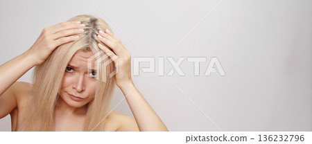 Blonde Hair Concern. Caucasian Woman Worries About Hair Roots. Home Blogger Reviews Blonde Hair Dye And Scalp Issues. Closeup Of Woman Analyzing Her Hair Roots With Focus On Scalp And Texture Blonde Hair Concern. Caucasian Woman Worries About Hair Roots. Home Blogger Reviews Blonde Hair Dye And Scalp Issues. Closeup Of Woman Analyzing Her Hair Roots With Focus On Scalp And Texture 136232796