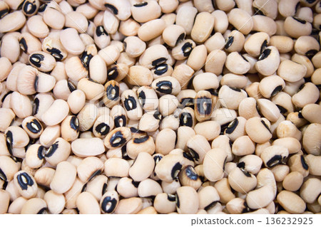 A full-frame shot of many raw black-eyed peas, a variety of cowpea bean 136232925