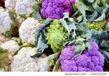 A selection of various types of cauliflower, including romanesco, regular and purple A selection of various types of cauliflower, including romanesco, regular and purple 136232939