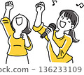 Two women having fun singing karaoke 136233109