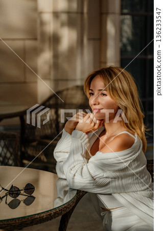 Woman White Cardigan Outdoor Cafe Table Woman White Cardigan Outdoor Cafe Table 136233547