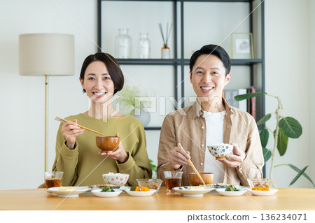 Middle-aged couple having breakfast at home Middle-aged couple having breakfast at home 136234071
