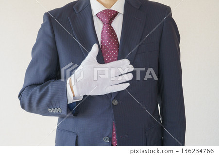 Relief / Omakase pose | A man in a suit who puts his hand on his chest Relief / Omakase pose | A man in a suit who puts his hand on his chest 136234766