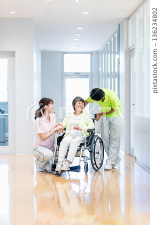 Image of a senior woman in a wheelchair and a caregiver Image of a senior woman in a wheelchair and a caregiver 136234802