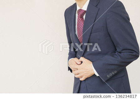 Businessman suffering from stomachache 136234817