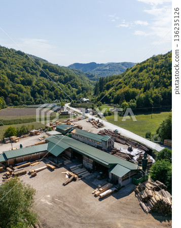 Aerial view of a sawmill factory in the mountains  136235126