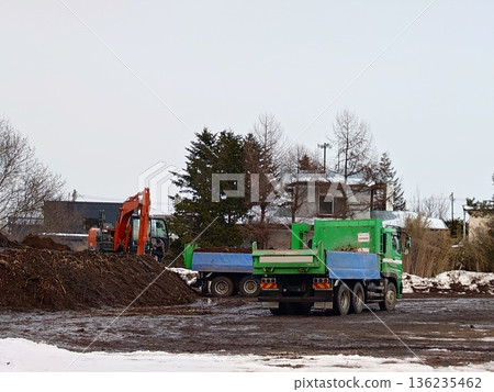 Hydraulic excavators and dump trucks Hydraulic excavators and dump trucks 136235462