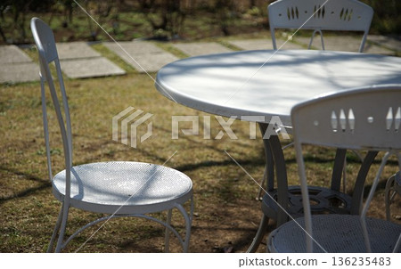 Garden table and chairs on a sunny day 136235483