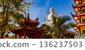 Buddha statue surrounded pagdas at Chua Hue Chieu temple in Kontum, Vietnam, Panorama 136237503