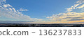 The city and the wide sky bathed in the morning glow 136237833