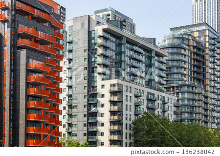 Modern apartment buildings with orange balconies in London city 136238042