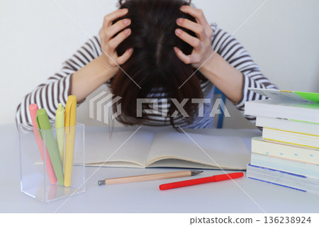 Hands of a woman struggling with studying 136238924