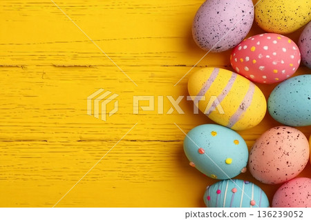 Colorful Easter Egg side border over a bright yellow wood background. Copy space. Colorful Easter Egg side border over a bright yellow wood background. Copy space. 136239052