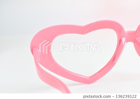 pink heart shape of glasses on white background 136239122