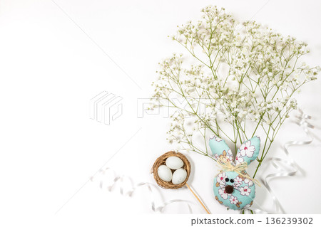 Decorative Easter bunny with flowers and eggs on white background Top view Copy space Decorative Easter bunny with flowers and eggs on white background Top view Copy space 136239302
