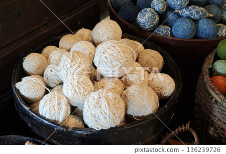 A group of yarns dyed with indigo and natural colors used in handicrafts and weaving. A group of yarns dyed with indigo and natural colors used in handicrafts and weaving. 136239726