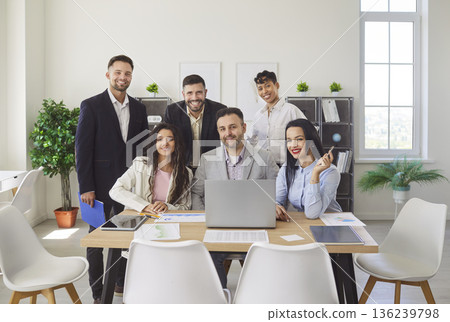 Happy business team of employees with high motivation to work on corporate project in office 136239798