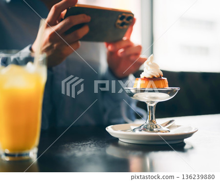 Taking a photo of pudding with a smartphone Taking a photo of pudding with a smartphone 136239880