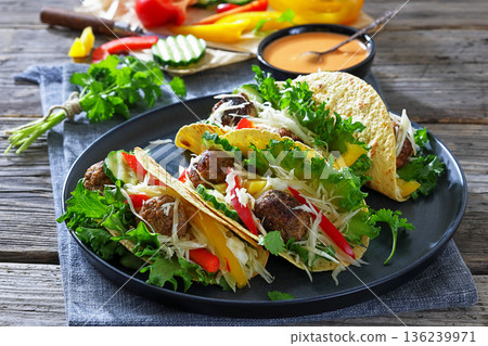 Lamb meatball tacos with fresh veggies on a plate 136239971