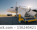 Boarding to airplane at airport 136240421
