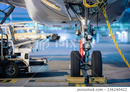 Aircraft nose wheel with red flag Remove Before Flight Aircraft nose wheel with red flag Remove Before Flight 136240422
