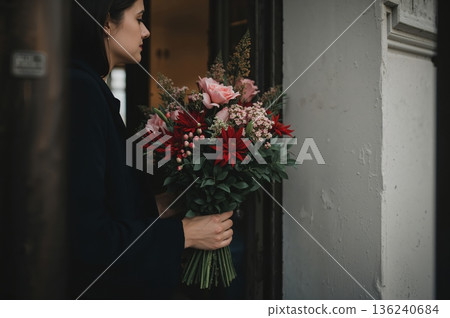 Person holding bouquet outside apartment door, ready to knock in soft daylight Person holding bouquet outside apartment door, ready to knock in soft daylight 136240684