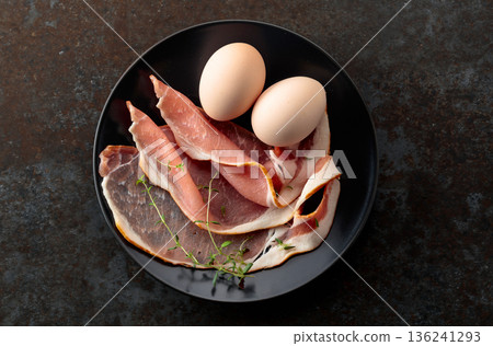 Pork bacon with thyme and eggs. Pork bacon with thyme and eggs. 136241293