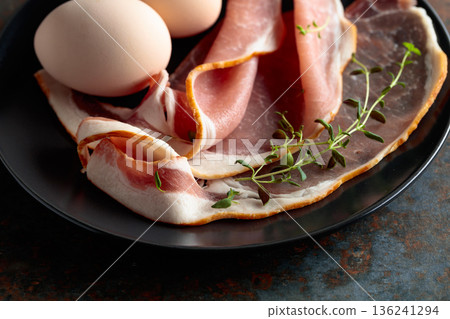 Pork bacon with thyme and eggs. Pork bacon with thyme and eggs. 136241294