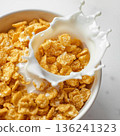 Cornflakes poured with milk 136241323