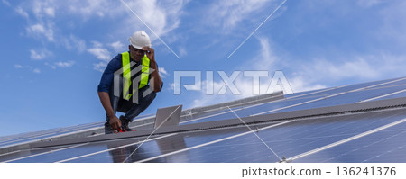 Engineer service check installation solar cell on the roof of factory. Engineer service check installation solar cell on the roof of factory. 136241376