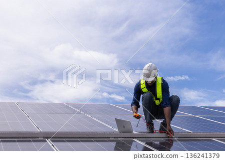 Engineer service check installation solar cell on the roof of factory. Engineer service check installation solar cell on the roof of factory. 136241379