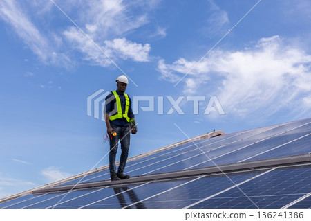Engineer service check installation solar cell on the roof of factory. Engineer service check installation solar cell on the roof of factory. 136241386