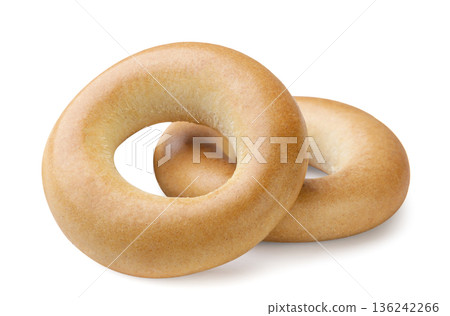 Two dried bagels close-up on a white. Isolated Two dried bagels close-up on a white. Isolated 136242266