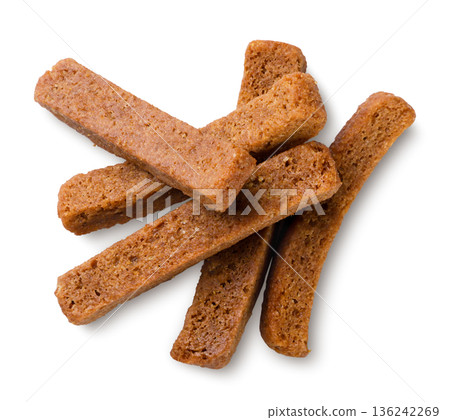 Pile of rye croutons close-up on a white background. Top view 136242269