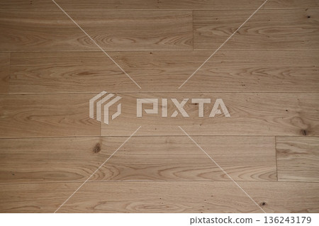 A wooden floor with a pattern of brown wood grain A wooden floor with a pattern of brown wood grain 136243179